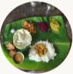 Traditional Udupi meal served on a banana leaf